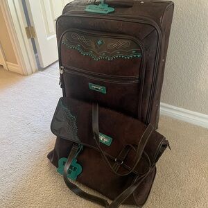 Hard to find Kathy  Van Zeeland Brown western luggage. Add shipping charges
